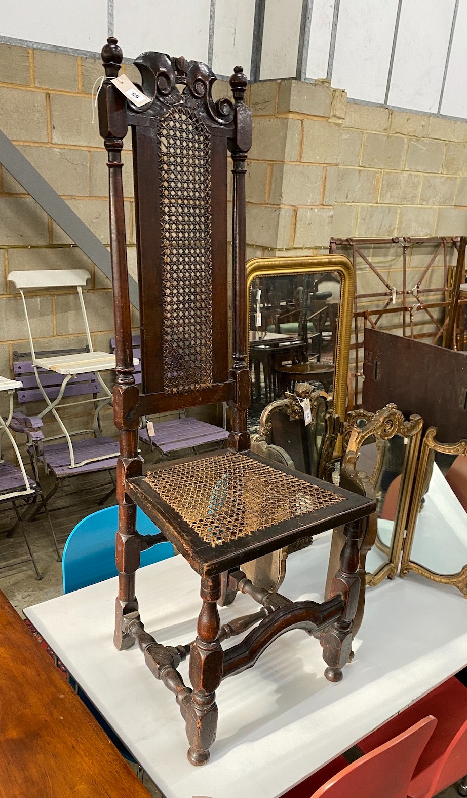 An 18th century caned walnut high back dining chair
